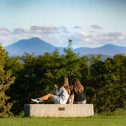 students sitting on a bench