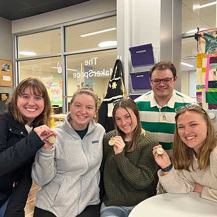 students showing their medals